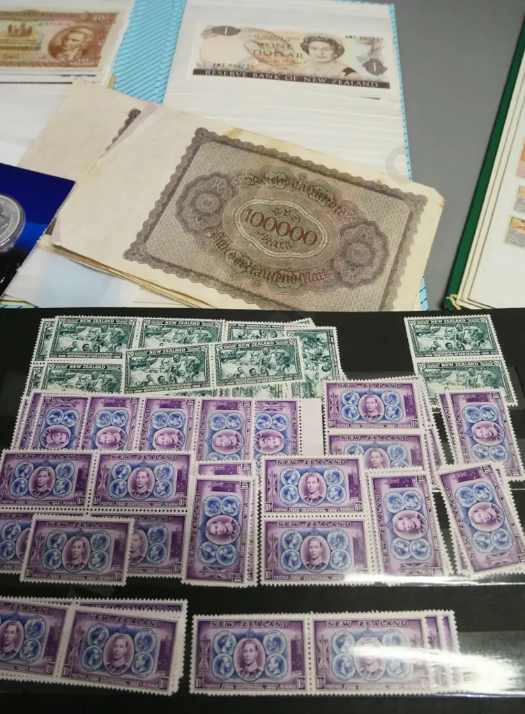 assorted stamp albums, coins and notes Image 1++