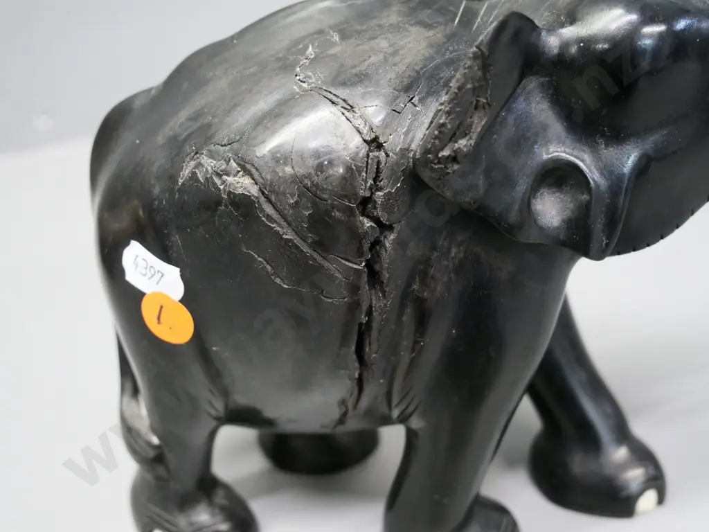 4 ebony elephants - largest has timber fault with filler coming out H210 L220, others have missing or part tusks Image 1++