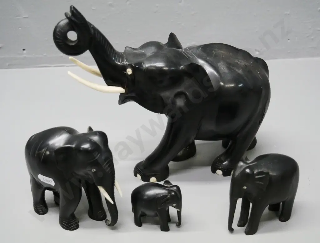 4 ebony elephants - largest has timber fault with filler coming out H210 L220, others have missing or part tusks Image 1++