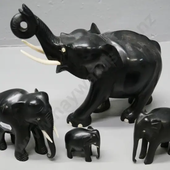 4 ebony elephants - largest has timber fault with filler coming out H210 L220, others have missing or part tusks