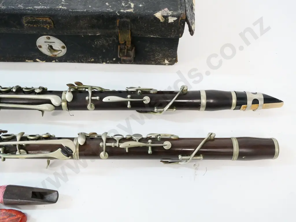 2 vintage clarinets, unsure of playing condition, slightly larger has no mouthpiece, includes reeds & battered case Image 1++