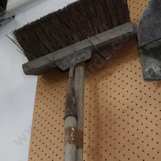 vintage hoe and a yard broom