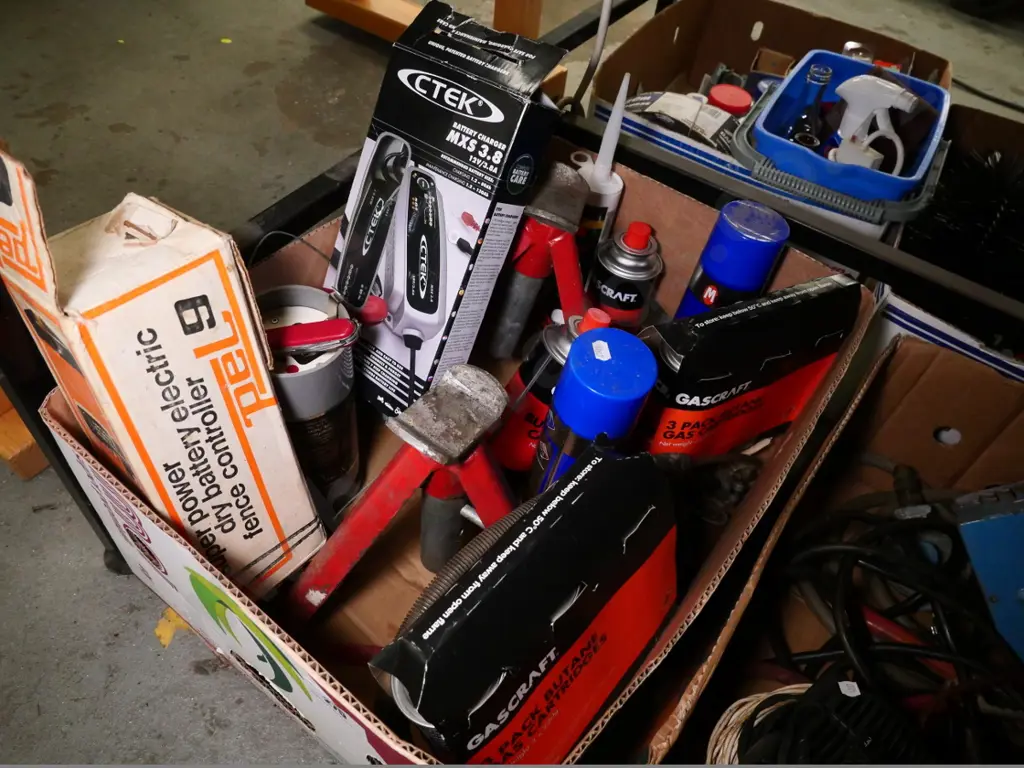 box of axle stands, battery charger, gas cartridges, etc. Image 1++