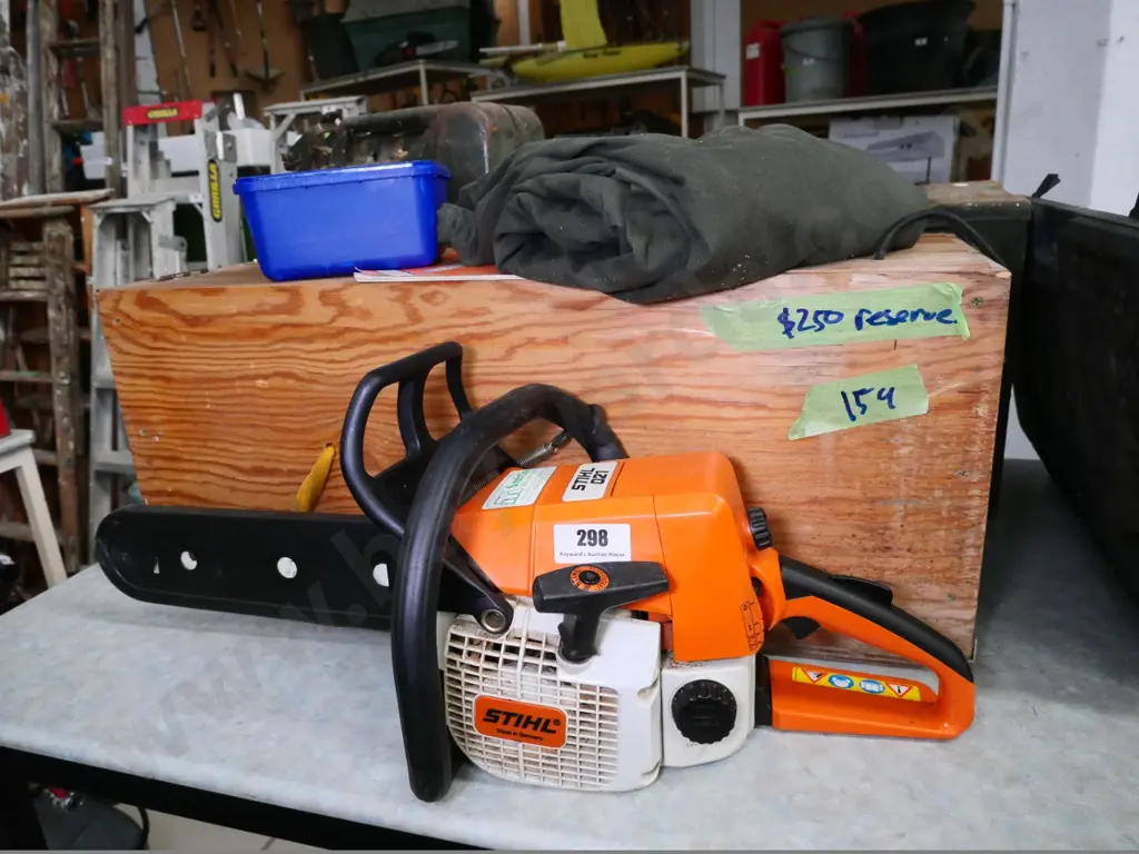 Stihl 021 chainsaw with wooden carry case, safety trousers, etc. Image 1++