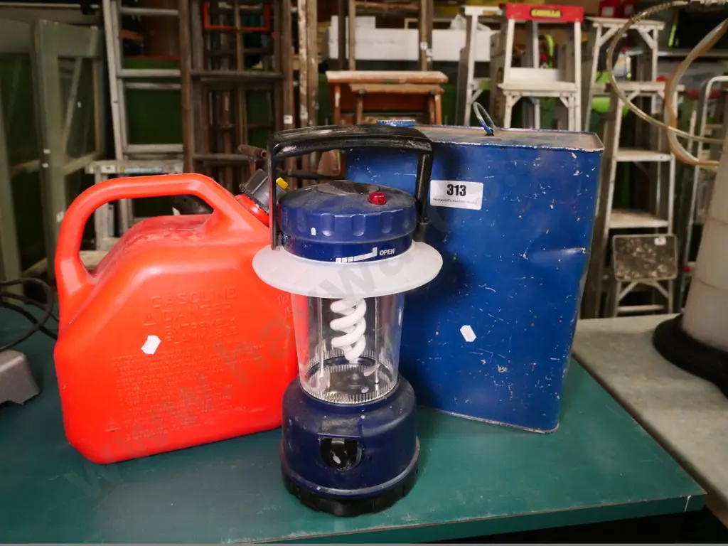 2 fuel containers and a camping light Image 1++