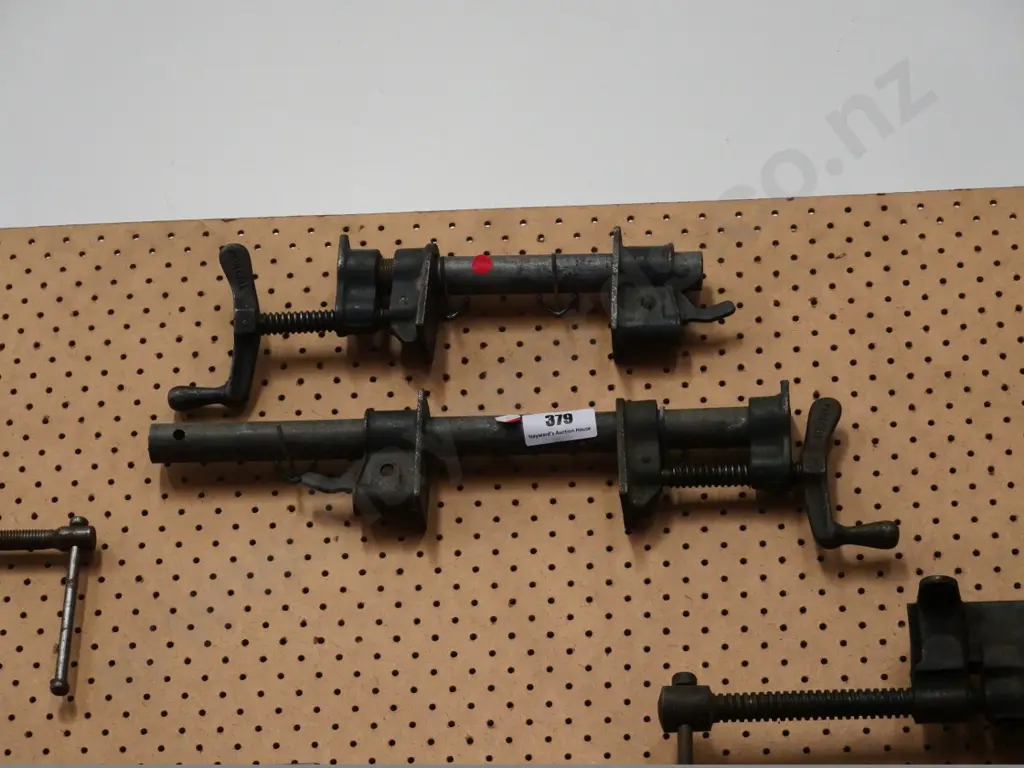 2 small pipe clamps - red dots Image 1++