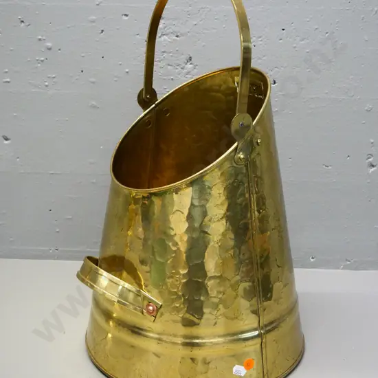 beaten brass coal scuttle with Tinware Dunedin label H-390 with handle down