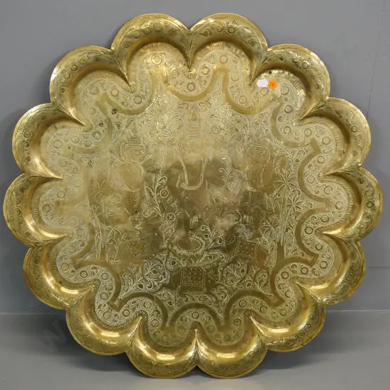 large brass scalloped-edge tray with etched Indian motif pattern Diameter 610