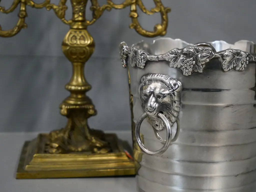 cast brass candelabrum H-290 W-230 and a silver plated ice bucket with lifter and lion head handles Image 1++
