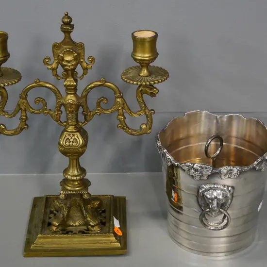 cast brass candelabrum H-290 W-230 and a silver plated ice bucket with lifter and lion head handles