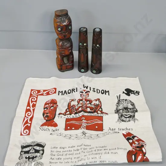 Maori motif souvenir ware - carved wood salt & pepper with paua insets, standing figure H-260 and a linen tea towel