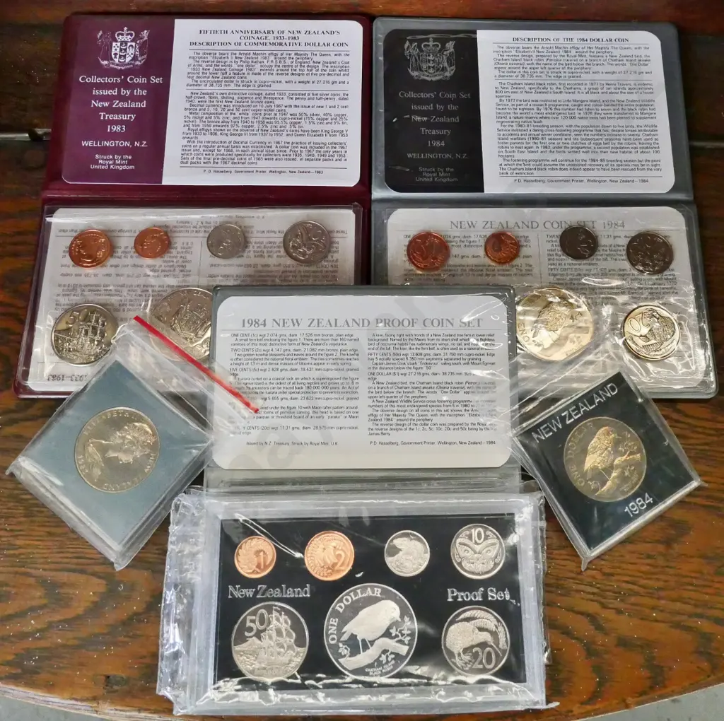 5 New Zealand collector coin items: 1983 collectors set,1984 cased proof set, 1984 collector set, 1983 and 1984 dollars Image 1++