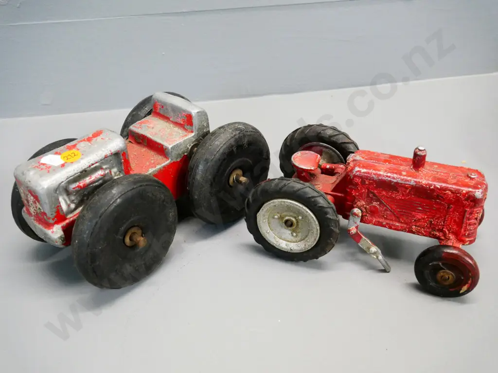 2 vintage die-cast tractors - smaller has damage and missing parts, front wheels likely not original on larger L-200 Image 1++
