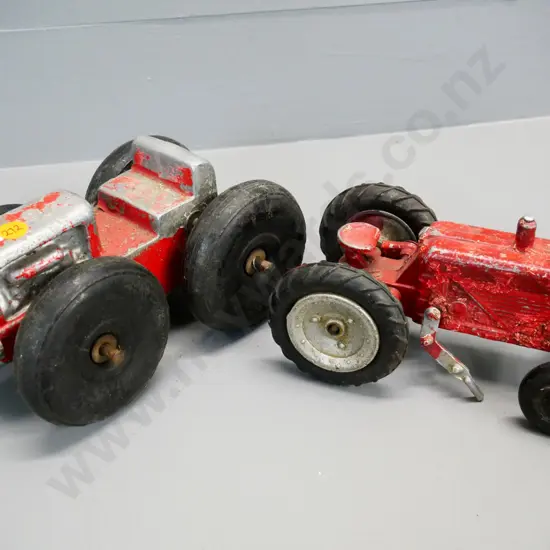 2 vintage die-cast tractors - smaller has damage and missing parts, front wheels likely not original on larger L-200
