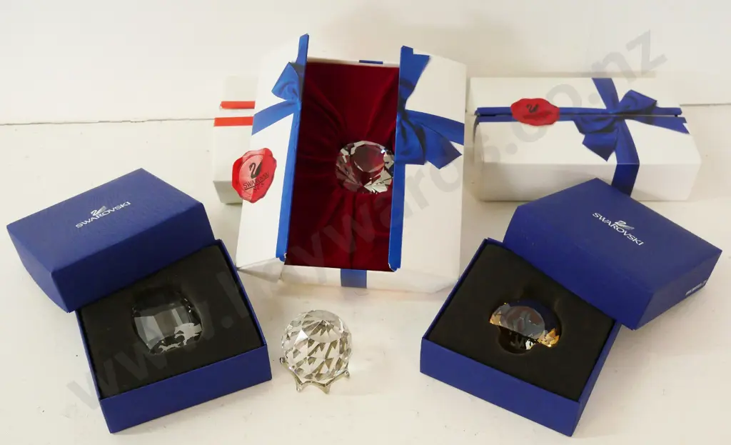 4 boxed Swarovski crystal ornaments - faceted crystal on stand and 3 others Image 1++