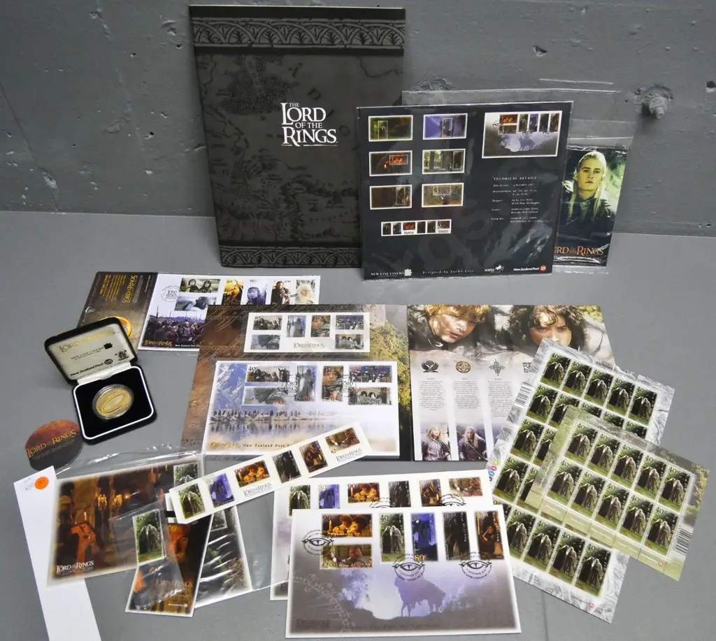 assorted Lord of the Rings commemorative postage stamps, first day covers, postcards & sterling silver cased $1 coin Image 1++