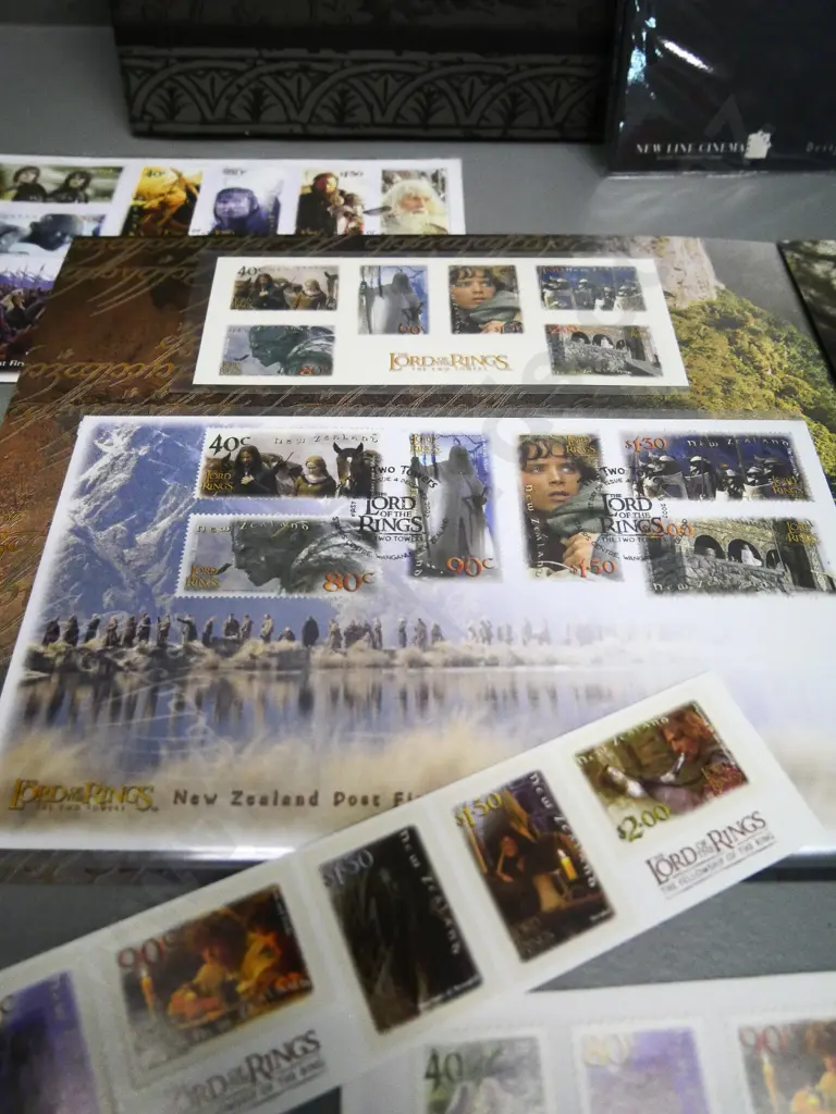 assorted Lord of the Rings commemorative postage stamps, first day covers, postcards & sterling silver cased $1 coin Image 1++