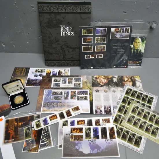 assorted Lord of the Rings commemorative postage stamps, first day covers, postcards & sterling silver cased $1 coin