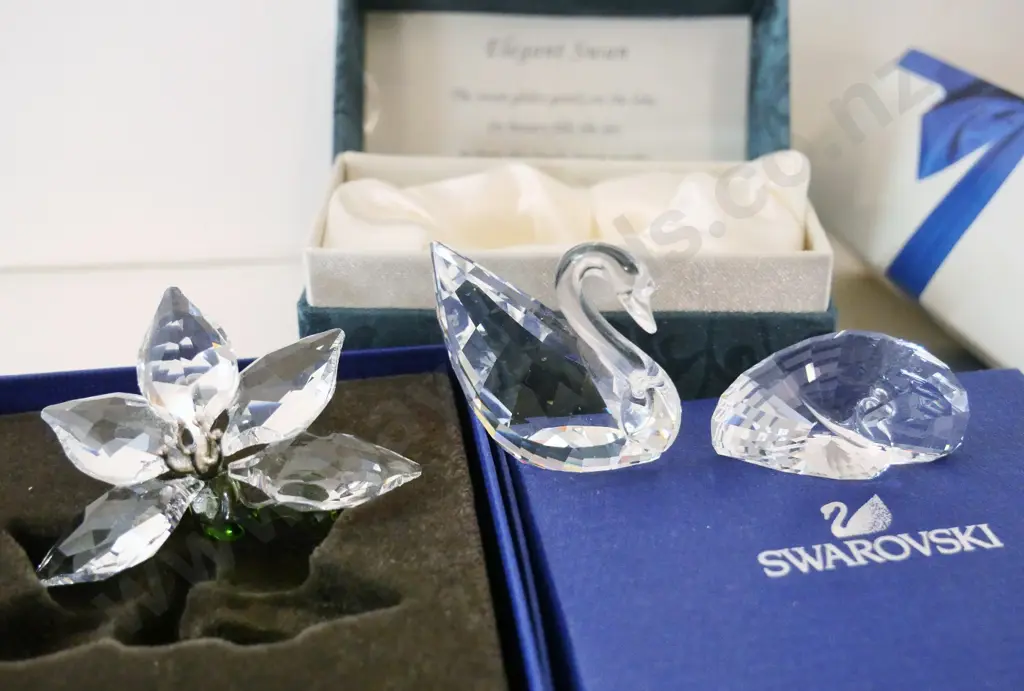 3 boxed Swarovski crystal ornaments and a boxed Chinese crystal swan Image 1++