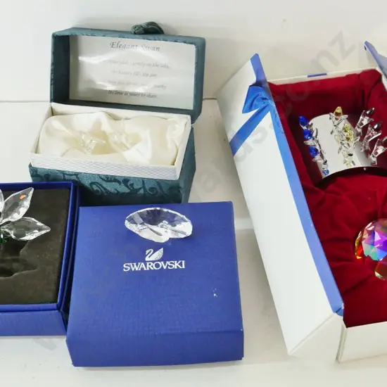 3 boxed Swarovski crystal ornaments and a boxed Chinese crystal swan