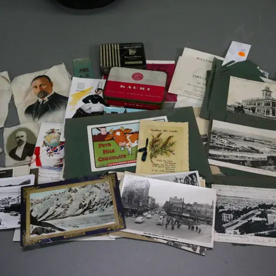 collection of photos, tins, greeting cards, portraits printed on fabric, early NZ postcards on torn album sheets etc.