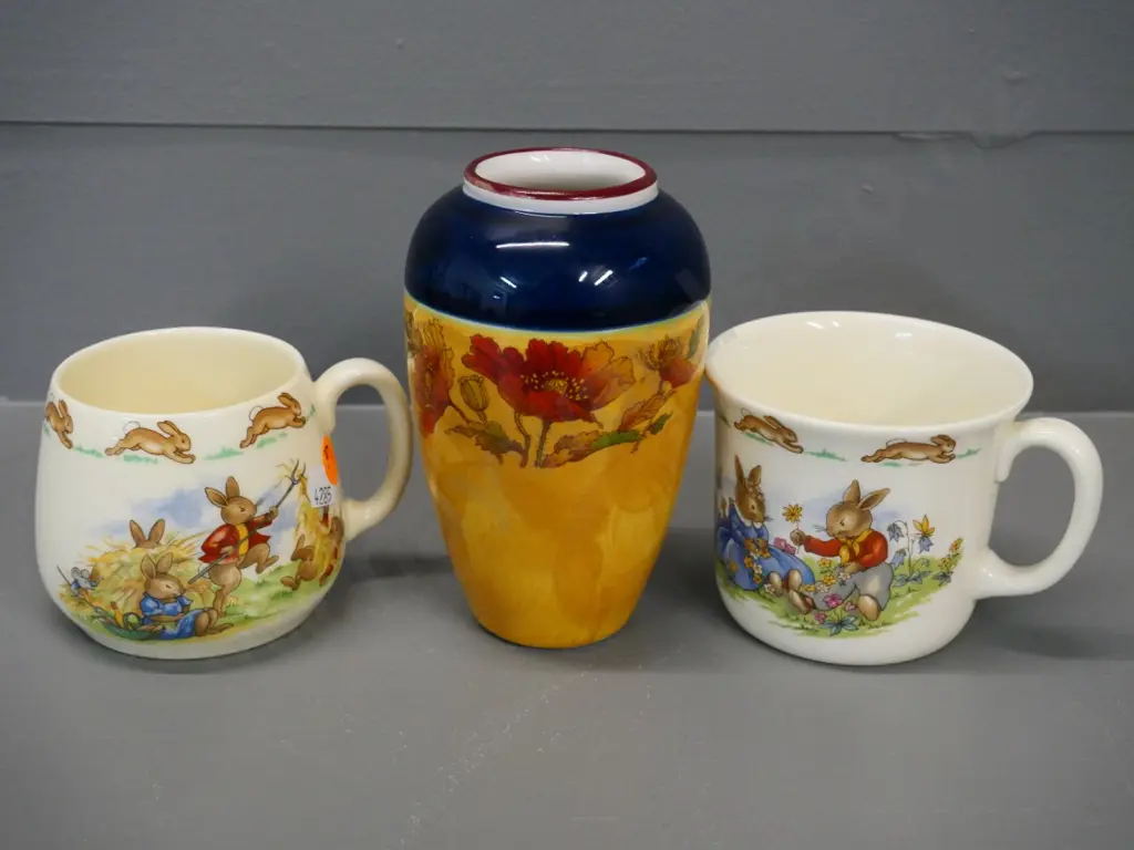 2 Royal Doulton Bunnykins mugs and a Robert Gordon Australia hand-painted ceramic vase H-130 Image 1++