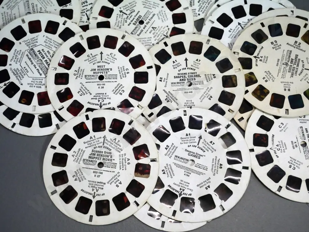 Viewmaster viewer with assorted loose reels - some are damaged - Muppets, Lion King, Sesame Street, etc. Image 1++