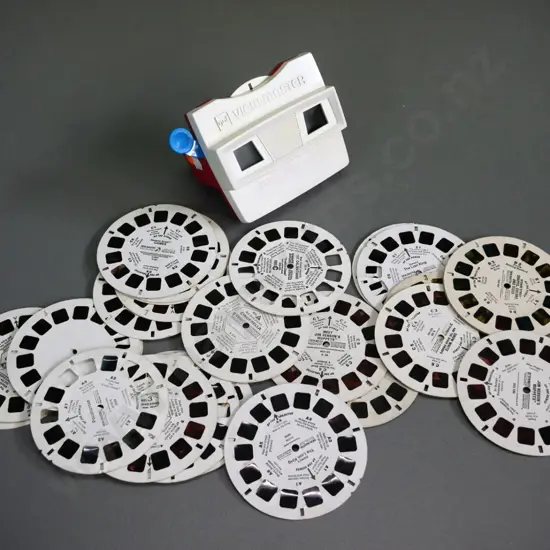 Viewmaster viewer with assorted loose reels - some are damaged - Muppets, Lion King, Sesame Street, etc.