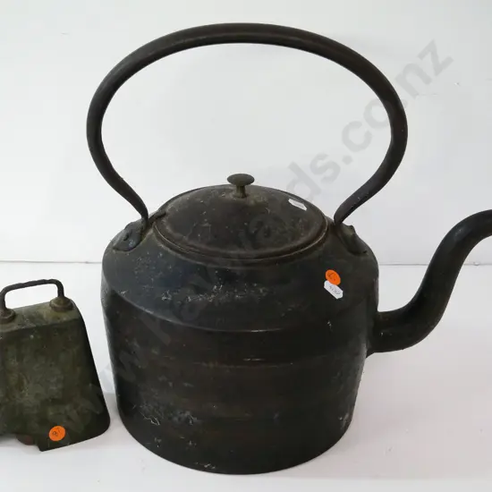 large cast iron kettle H-380 L-380, some pitting and rust - and a cast metal cowbell with piece broken off