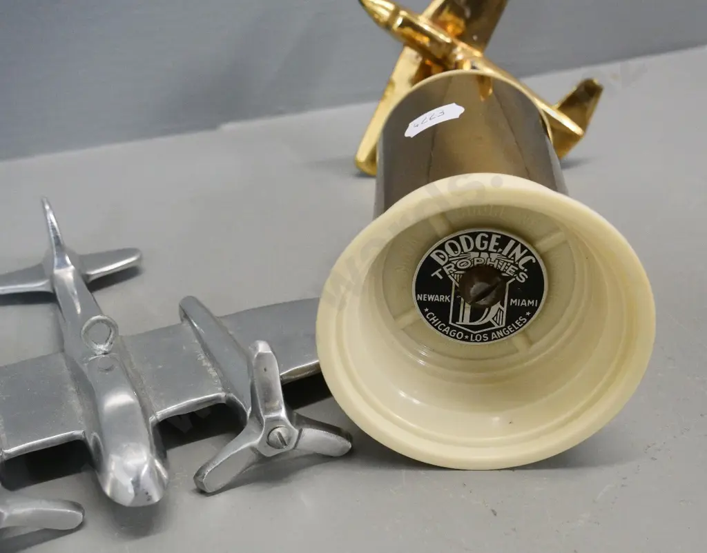 gold-tone metal and plastic aeroplane trophy H-190 engraved "Jr. Cl. B. - 2nd in Speed Section" and a chrome aeroplane Image 1++