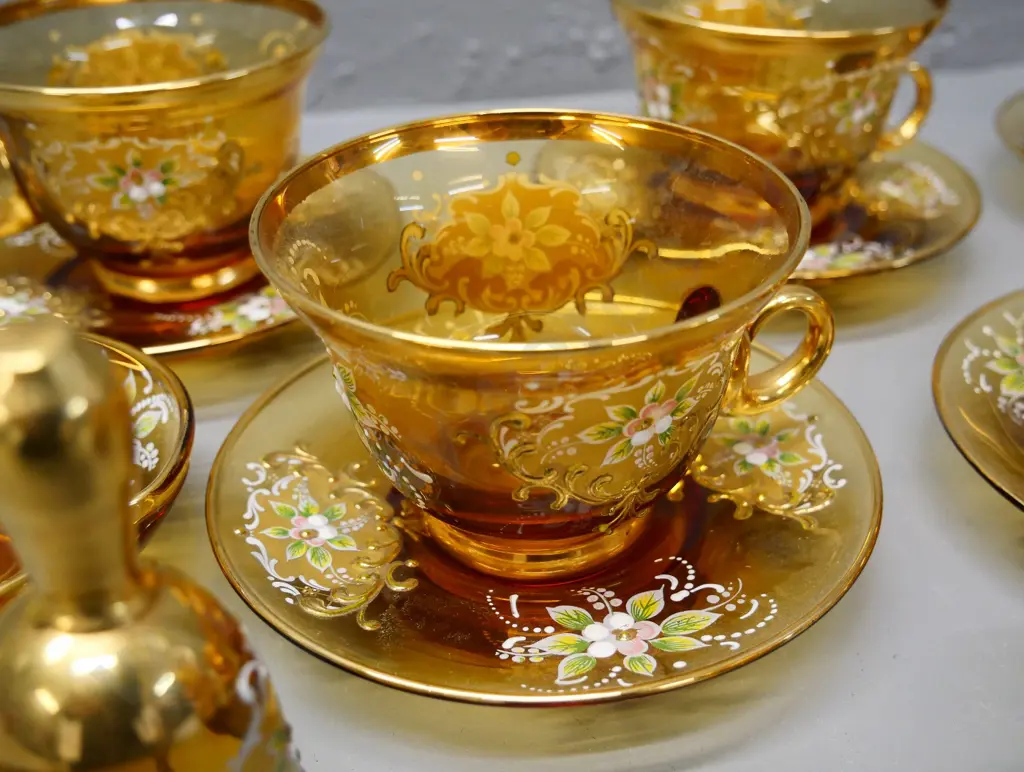 collection of Murano Venetian glass cups and saucers, jug, vase, bell, and dish & gold-plated coffee spoons Image 1++