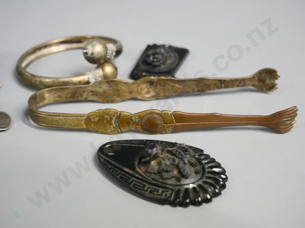 jet or faux jet carved necklace pieces, vintage ring cases, asian style metal sugar tongs and one other, bracelet, etc. Image 1++