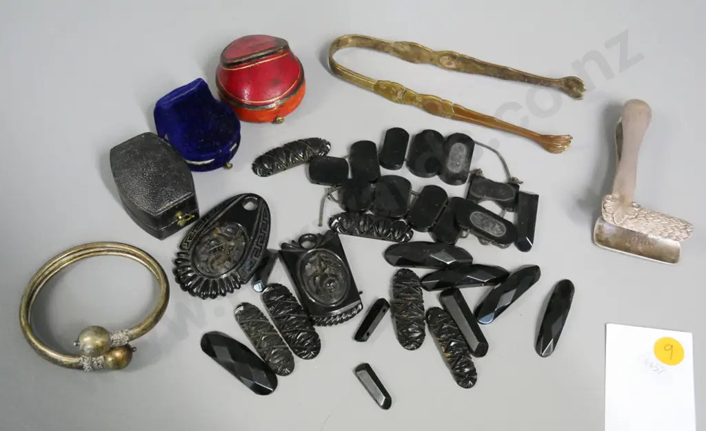 jet or faux jet carved necklace pieces, vintage ring cases, asian style metal sugar tongs and one other, bracelet, etc. Image 1++