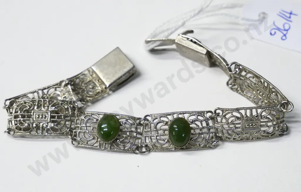 silver costume bracelet with 2 green stones no markings Image 1++