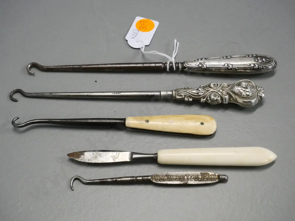 2 sterling silver handled button hooks, 2 other button hooks and a a bone-handled manicure item Image 1++