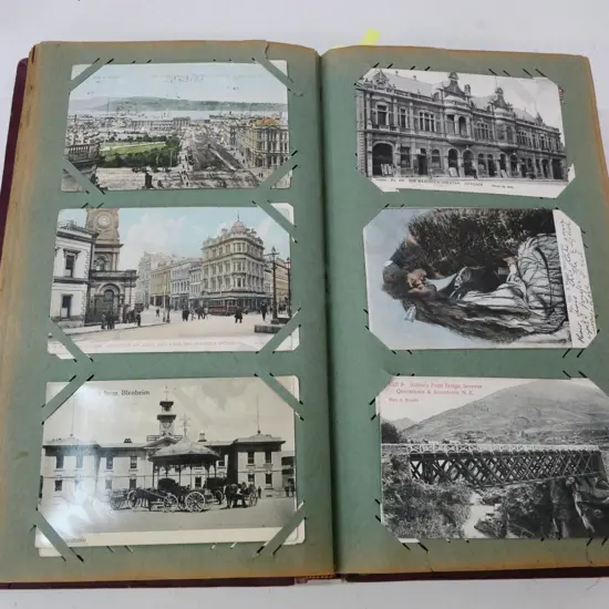 vintage postcard album with 400 early New Zealand postcards, mainly south island - damage to some backing pages