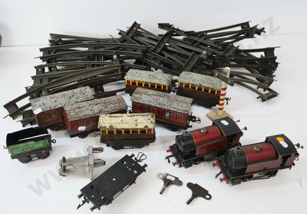 Hornby model train pieces - 2 key-wind locomotives, rolling stock and assorted track - general corrosion and wear Image 1++