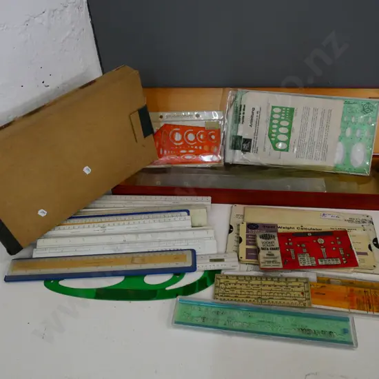large assortment of technical drawing rulers, stencils, French curves, etc. and wooden case L-570
