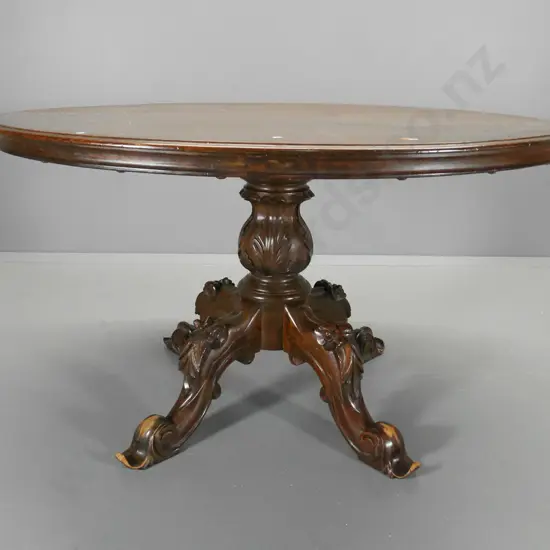 oval mahogany dining table with ornately carved pedestal base, damage esp. to feet H760 L1350 W1030
