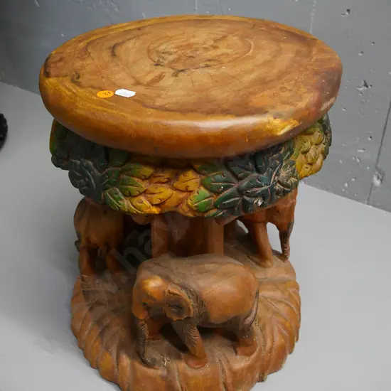 carved hardwood stool with elephants around base, partly hand-coloured - some chips H-360 D-300