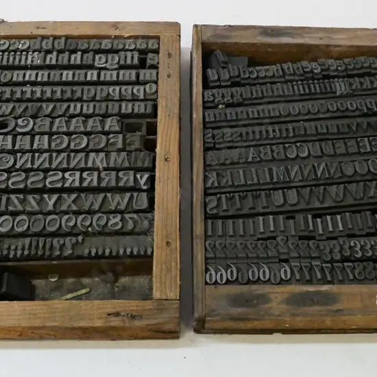 2 wooden trays of metal printing type - each 230x230