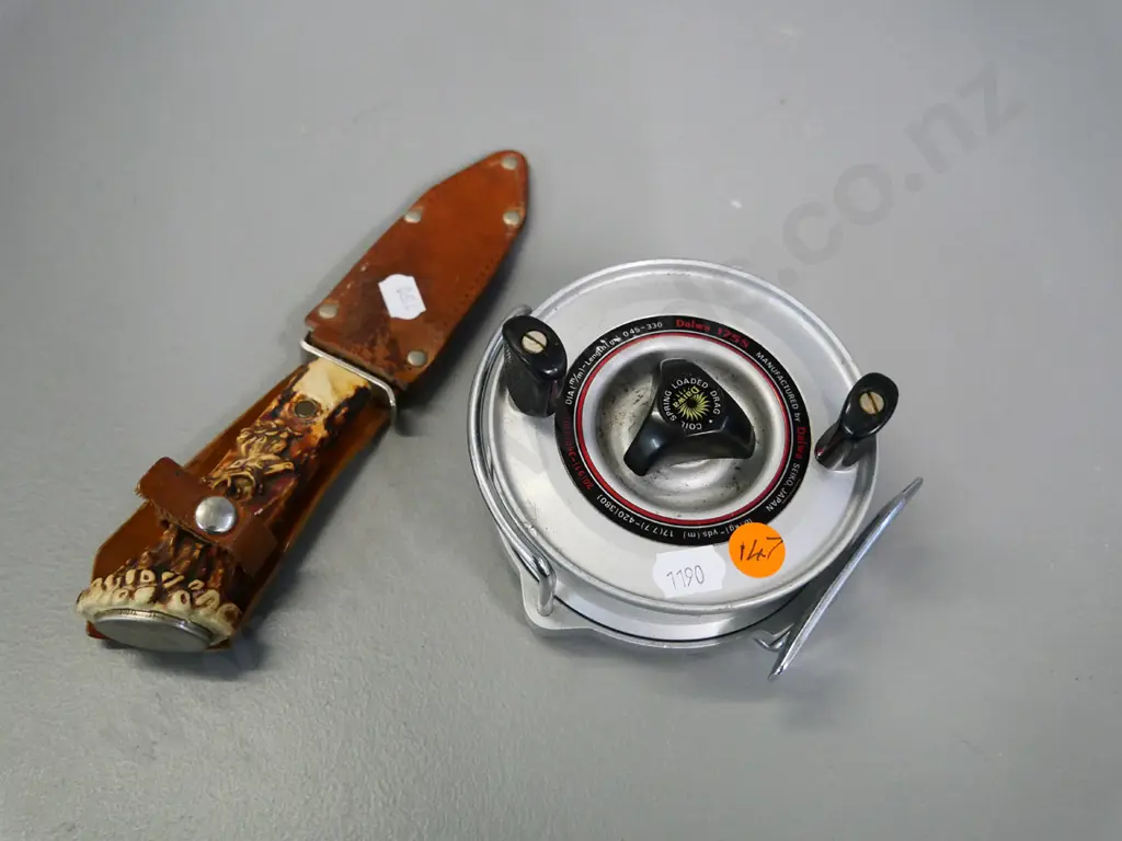 Daiwa 175s fishing reel and a German knife in leather sheath Image 1++