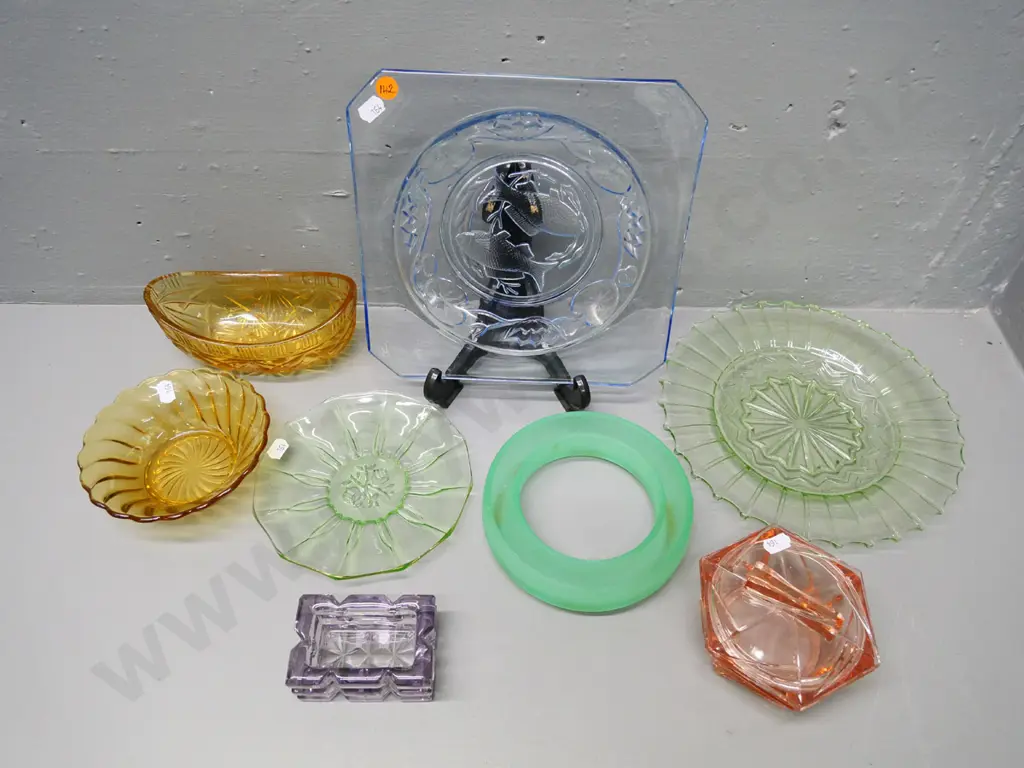 collection of coloured depression glass items including blue fish dish, green plates, pink jewellery box etc. Image 1++
