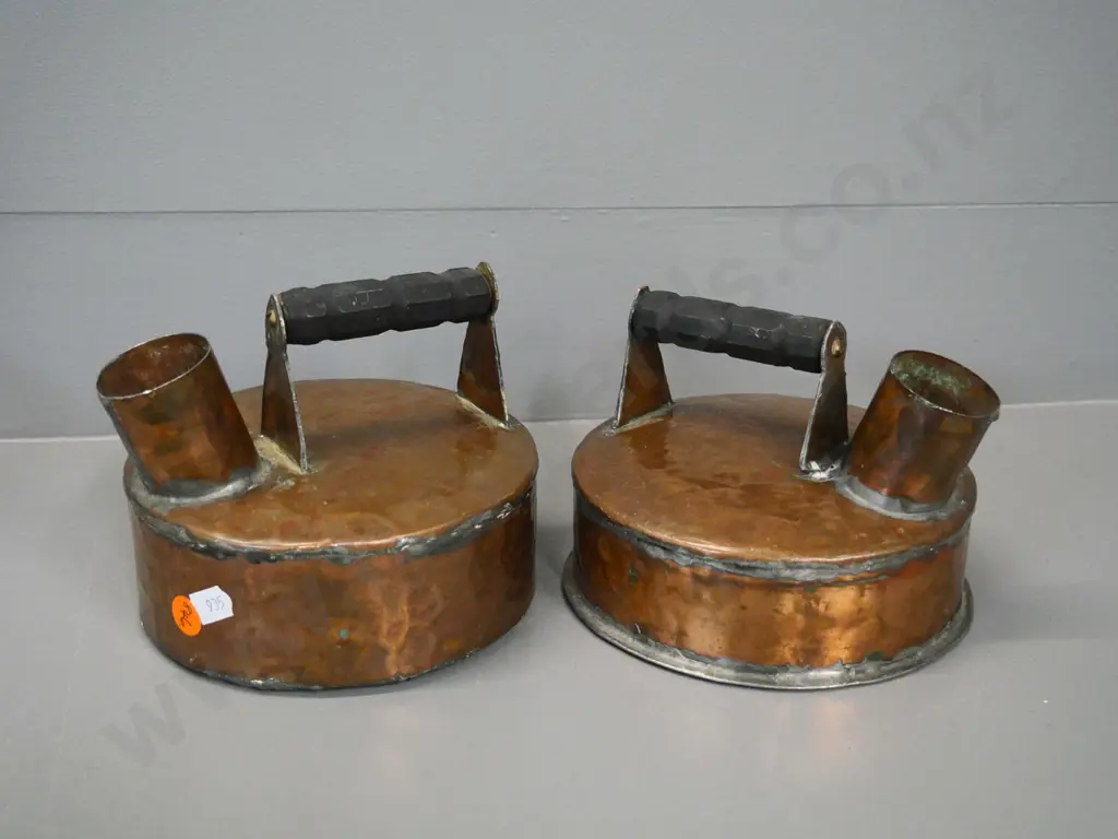 pair of small beaten copper kettles with wooden handles H-130 W-160 Image 1++