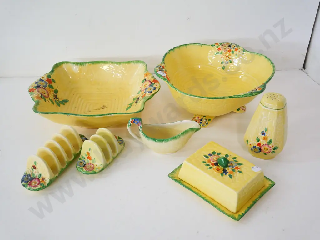 assorted Crown Devon yellow glaze floral items - 2 dishes, 2 toast racks, cover butter dish, caster shaker, sauce boat Image 1++