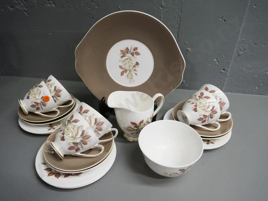Queen Anne 21-piece brown and cream rose pattern tea set - scratches to plate, crack thru one cup Image 1++