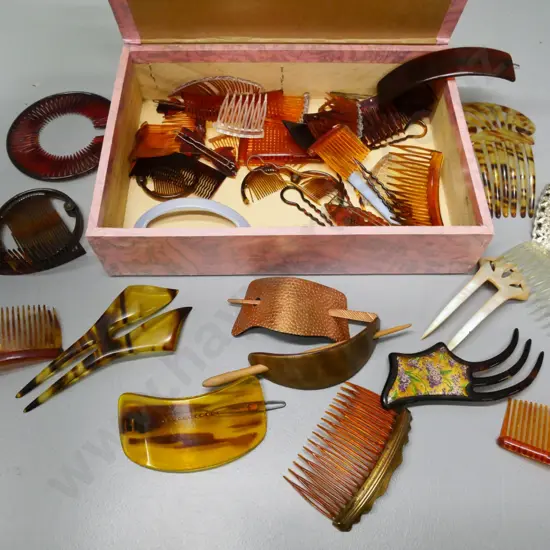assorted faux tortoise shell and other hair combs in chocolate box