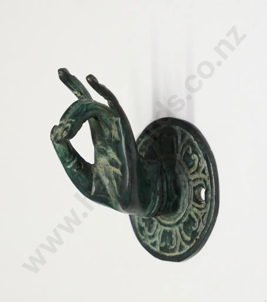 small brass ring holder in the shape of a hand Image 1++