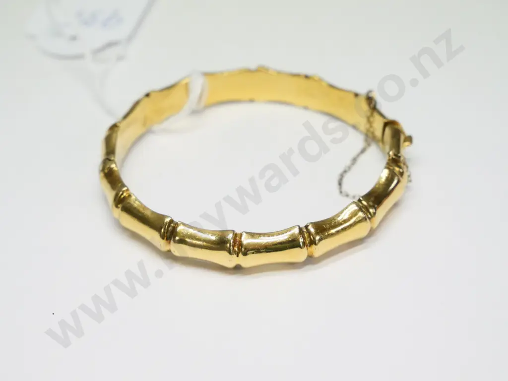rolled gold bangle with safety chain Image 1++