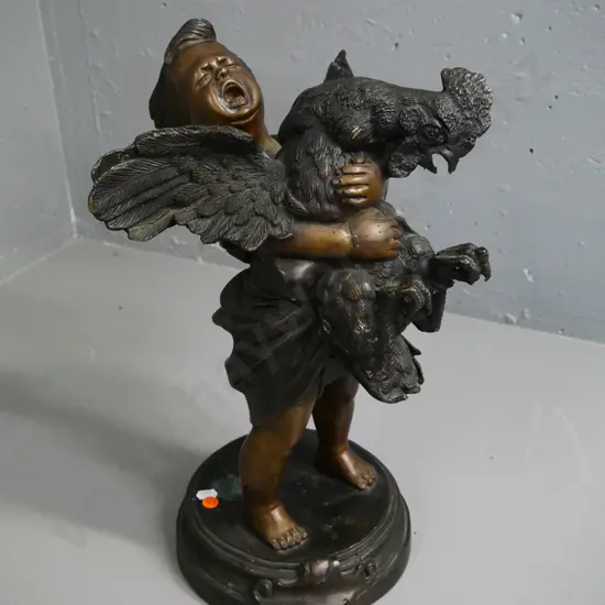cast metal (bronze?) figure - young boy with rooster - some marks and discolouration on base H-490